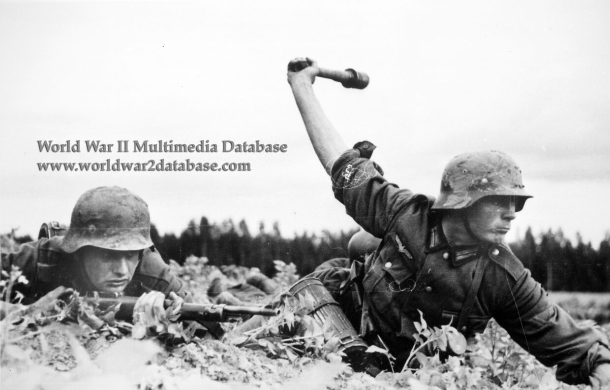 German Soldier Throws Stick Grenade