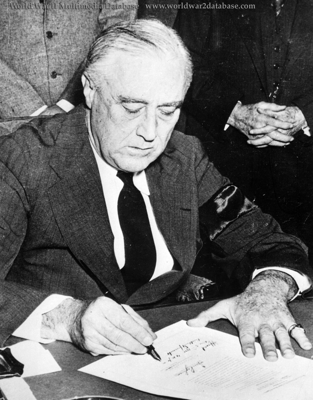 President Franklin D. Roosevelt Signs the Declaration of War Against Japan