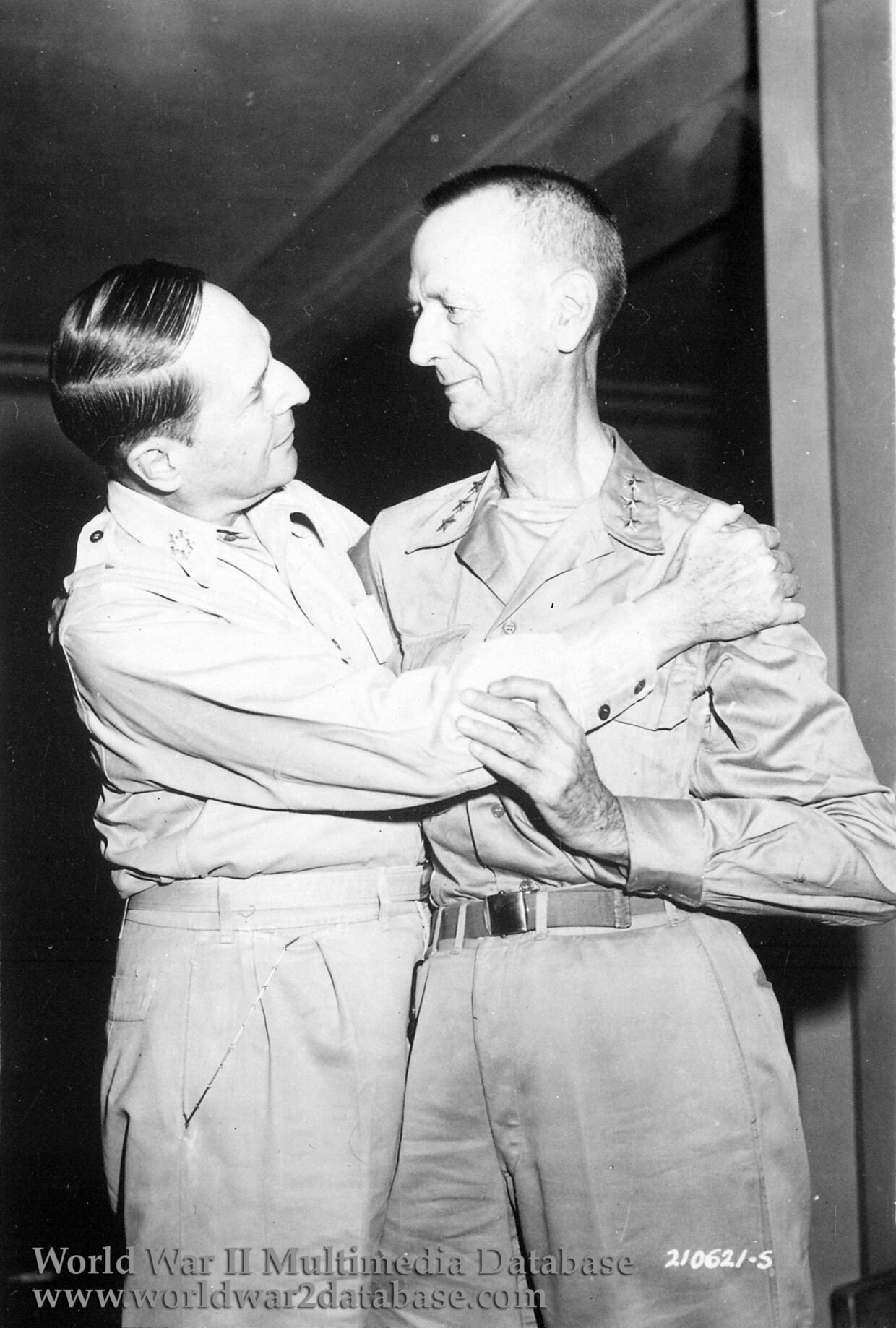 General of the Army Douglas MacArthur and Lieutenant General Jonathan Wainwright greet each other at the New Grand Hotel