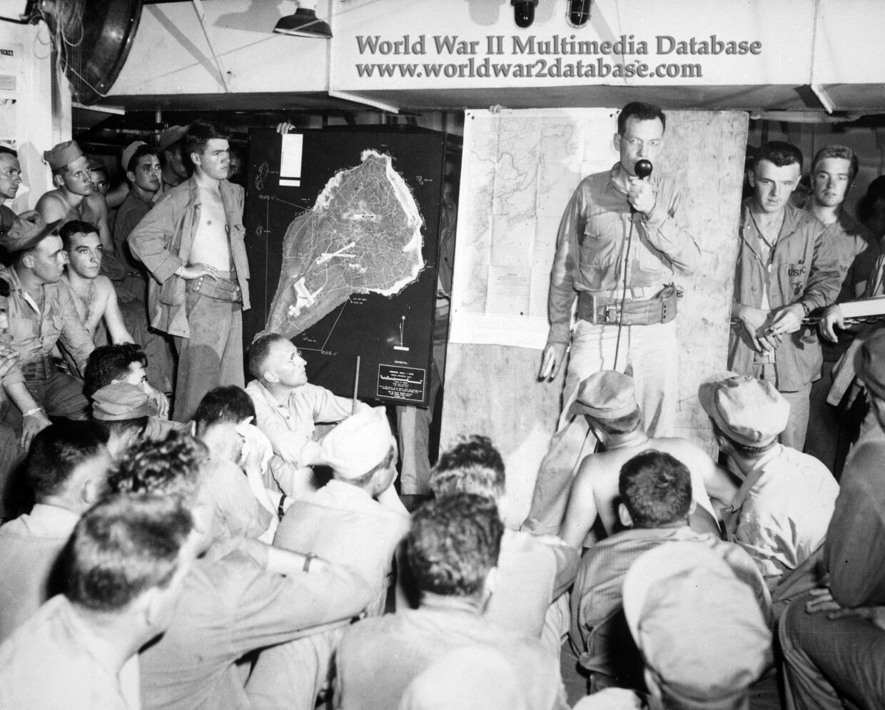 Platoon of Fourth Marine Division Briefed on Iwo Jima on Attack Transport