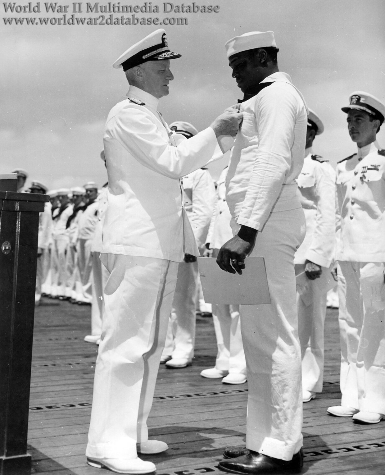 Mess Attendant Doris Miller Receives the Navy Cross from Admiral Chester W. Nimitz
