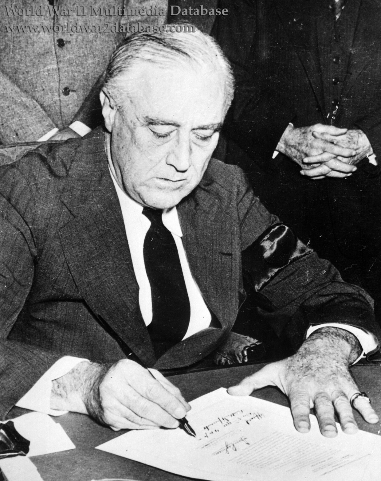President Franklin D. Roosevelt Signs the Declaration of War on Japan