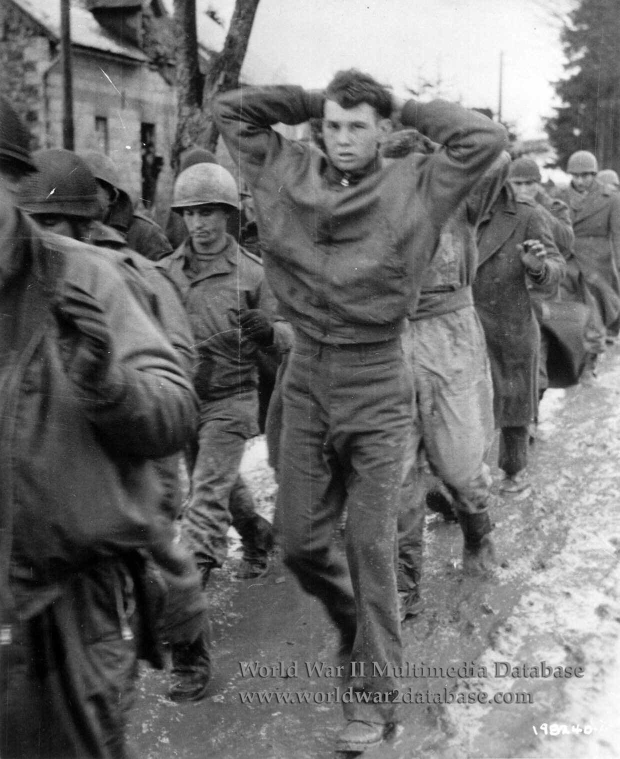 American Soldiers of the 99th Infantry Division March Into Captivity